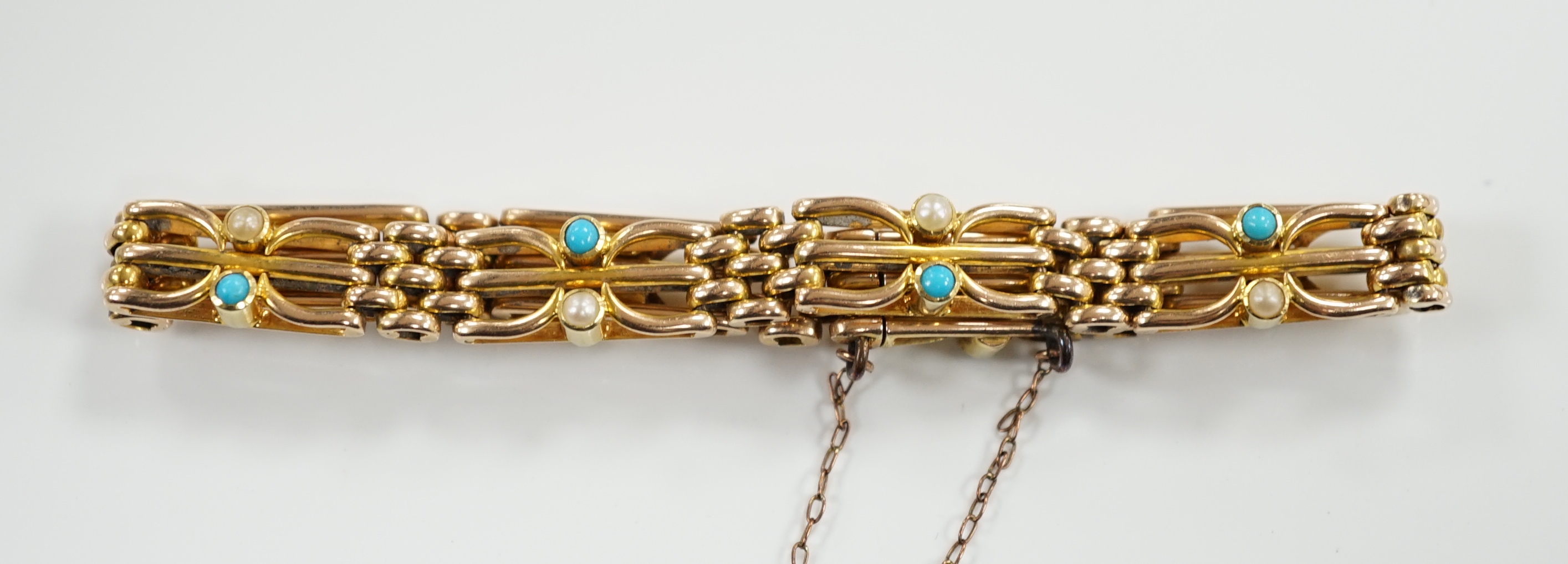 An Edwardian 15ct, turquoise and seed pearl set gate link bracelet, 18cm, gross weight 16.7 grams.